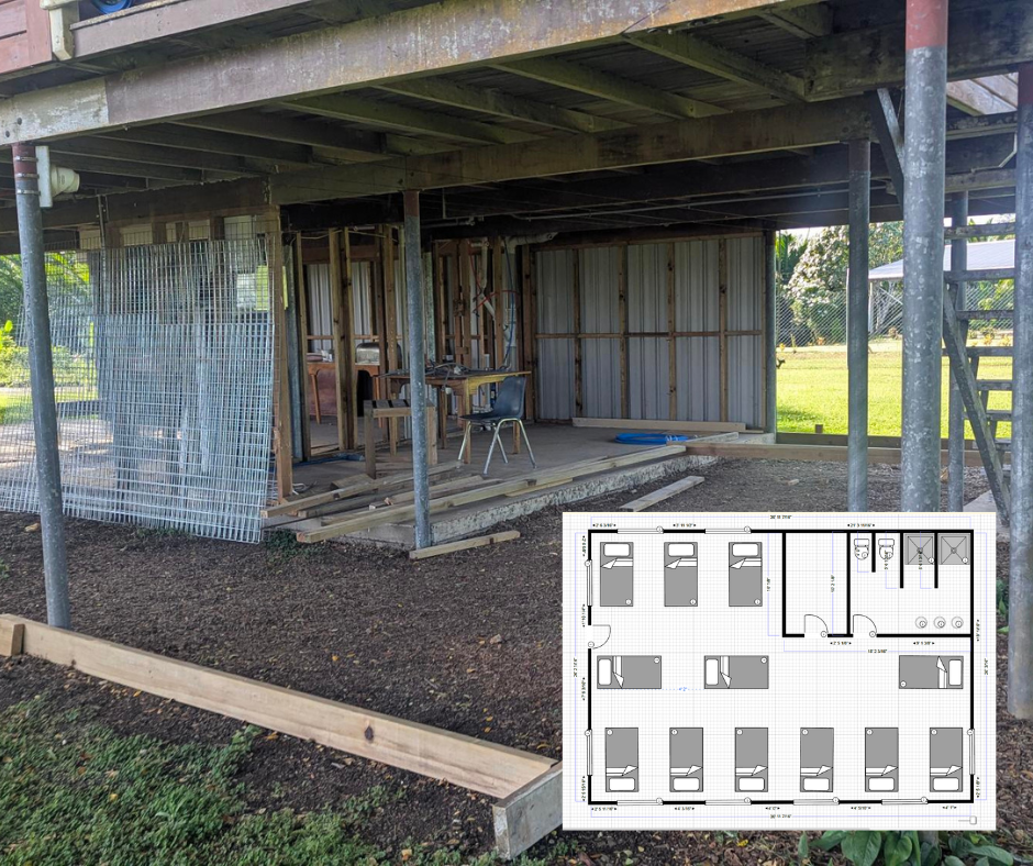 An empty construction site, below a house on stilts